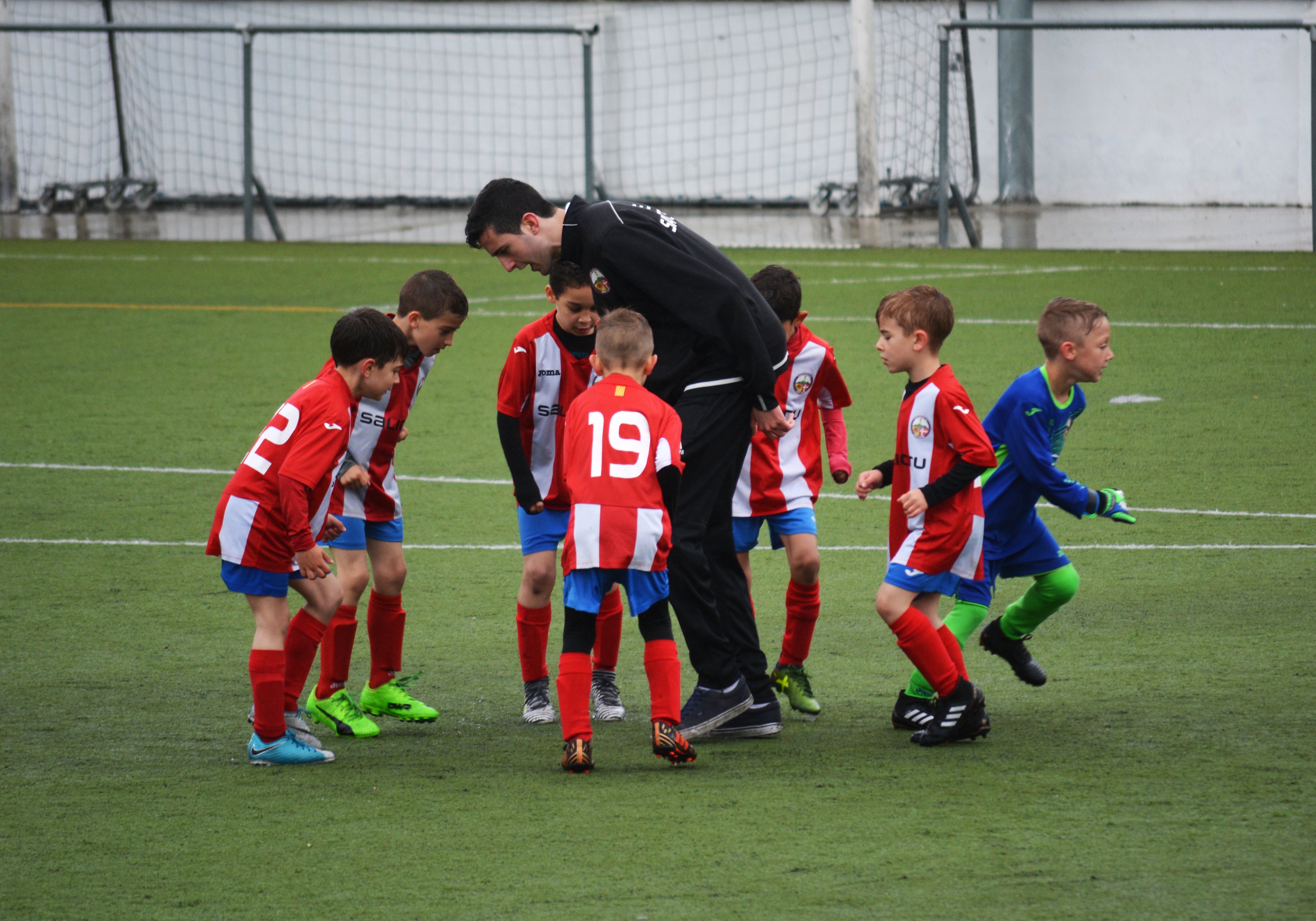 Young soccer team with their coach