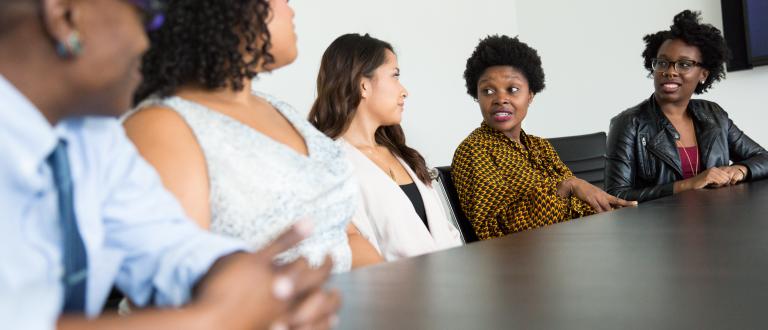 Women of colour in a meeting