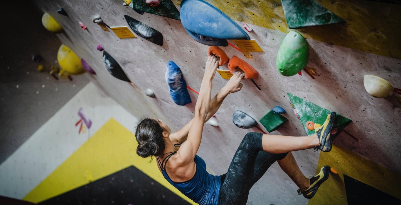 Woman on rock climbing wall